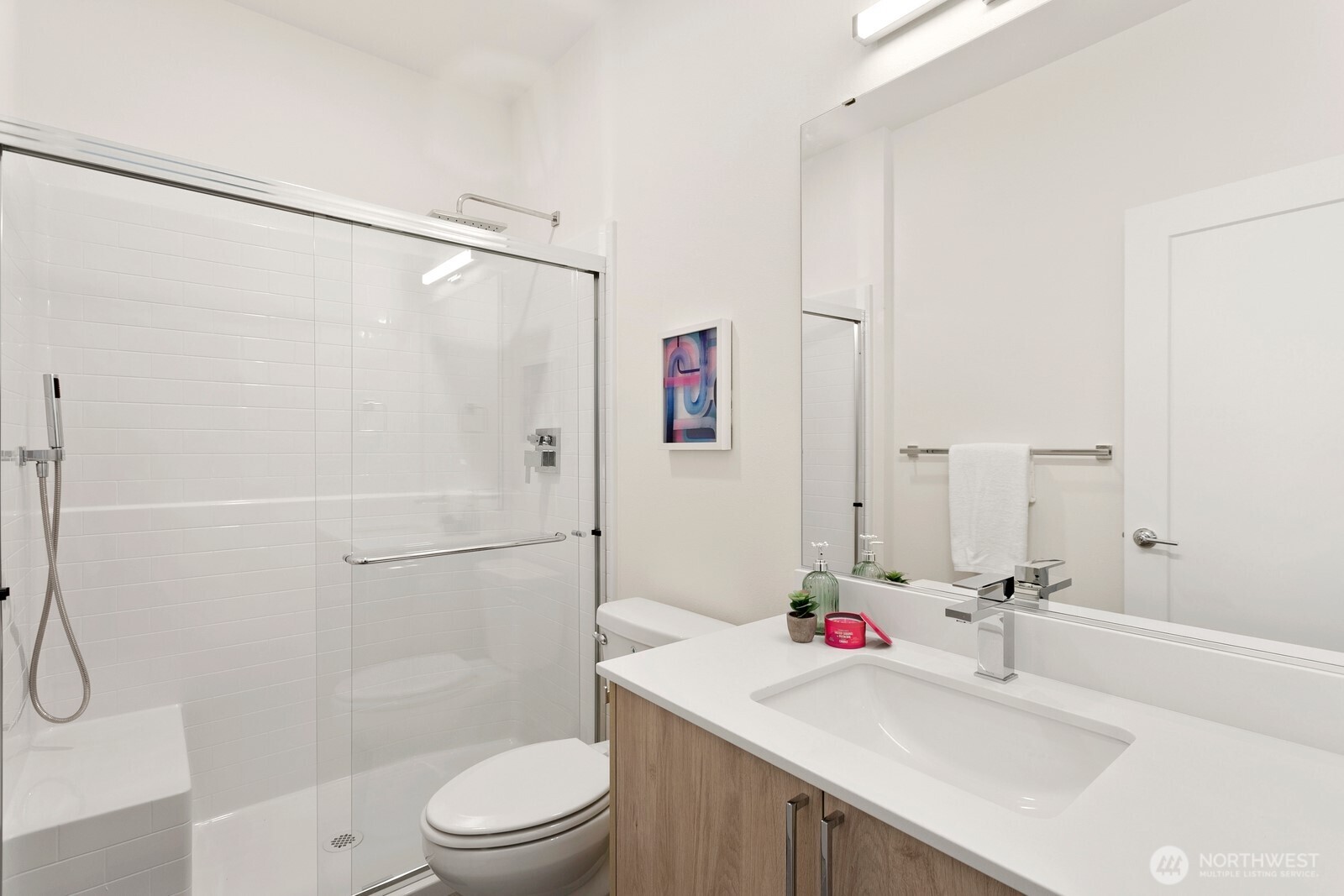 117 Wells Avenue South, Unit B Renton, WA 98057 - Photo 18 of 26 a bathroom with a sink toilet and shower