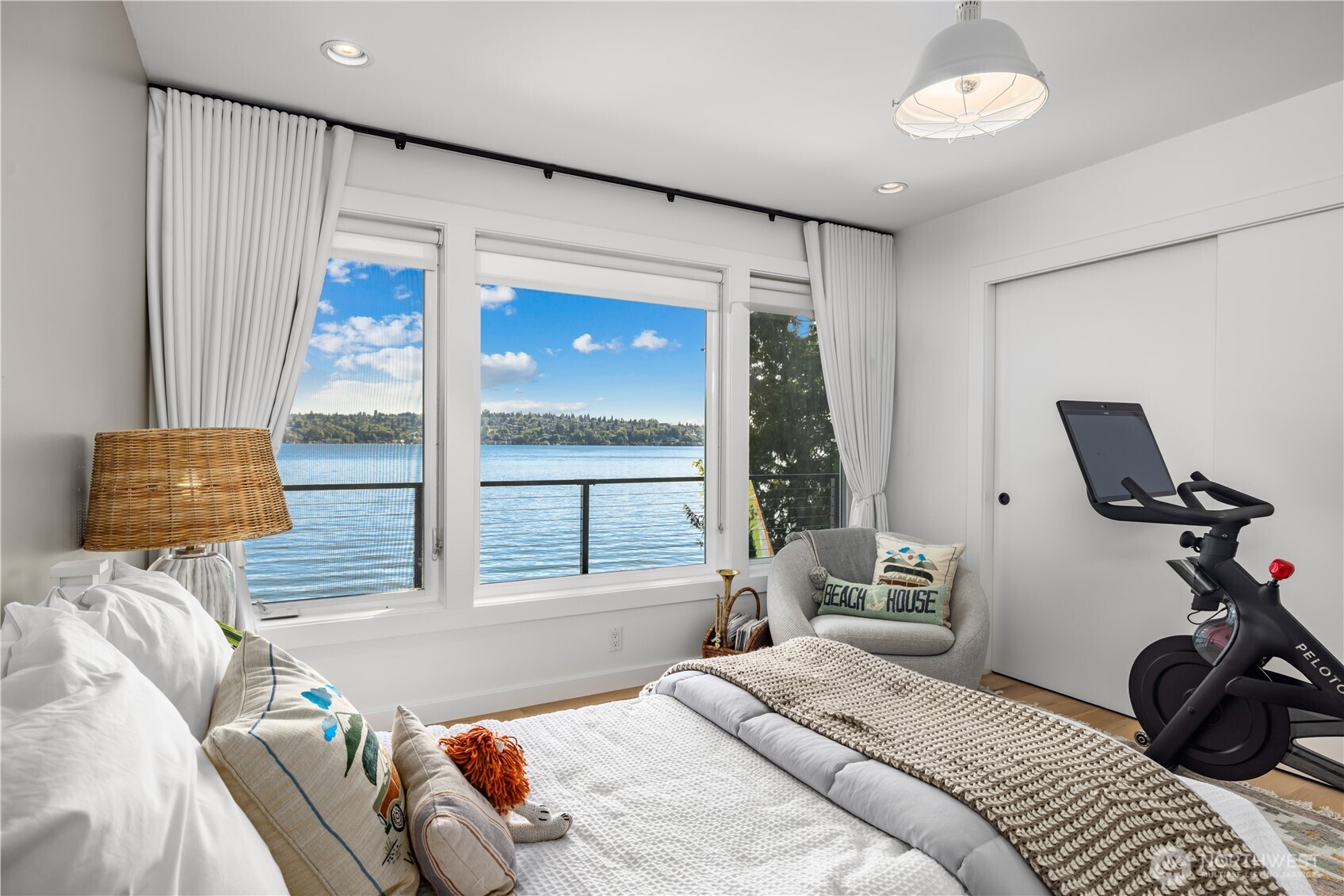 8097 West Mercer Way Mercer Island, WA 98040 - Photo 25 of 40 a bedroom with a bed and a window