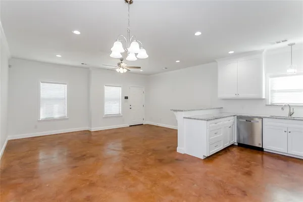 a kitchen with a sink stove and refrigerator