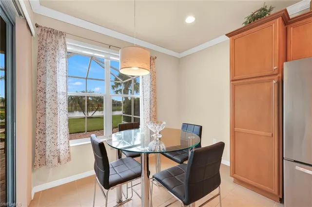 a view of a dining room with furniture window and outside view