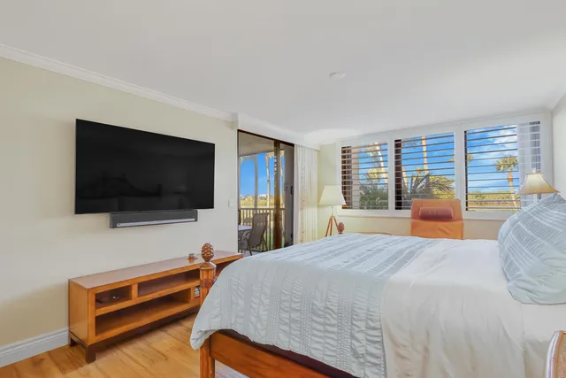 a spacious bathroom with a granite countertop sink and mirror