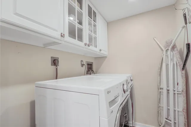 a balcony with furniture and a potted plant