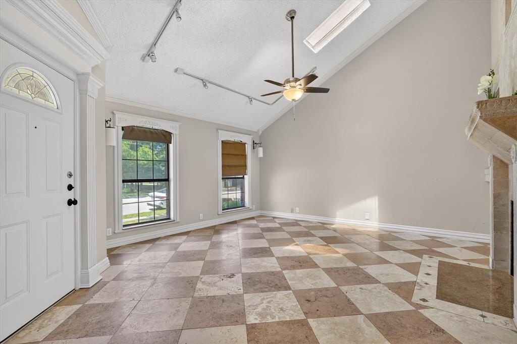 272 Lodge Road Coppell, TX 75019 - Photo 5 of 24 a view of an empty room with a window