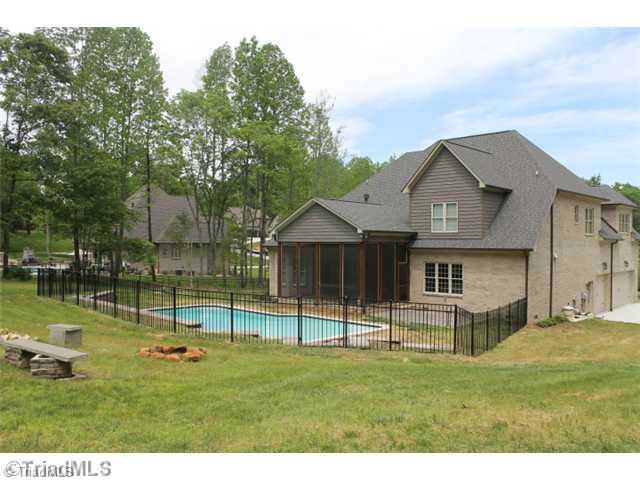 5808 Bison Drive Oak Ridge, NC 27310 - Photo 2 of 16 Exterior Back. Beautiful inground pool and fence