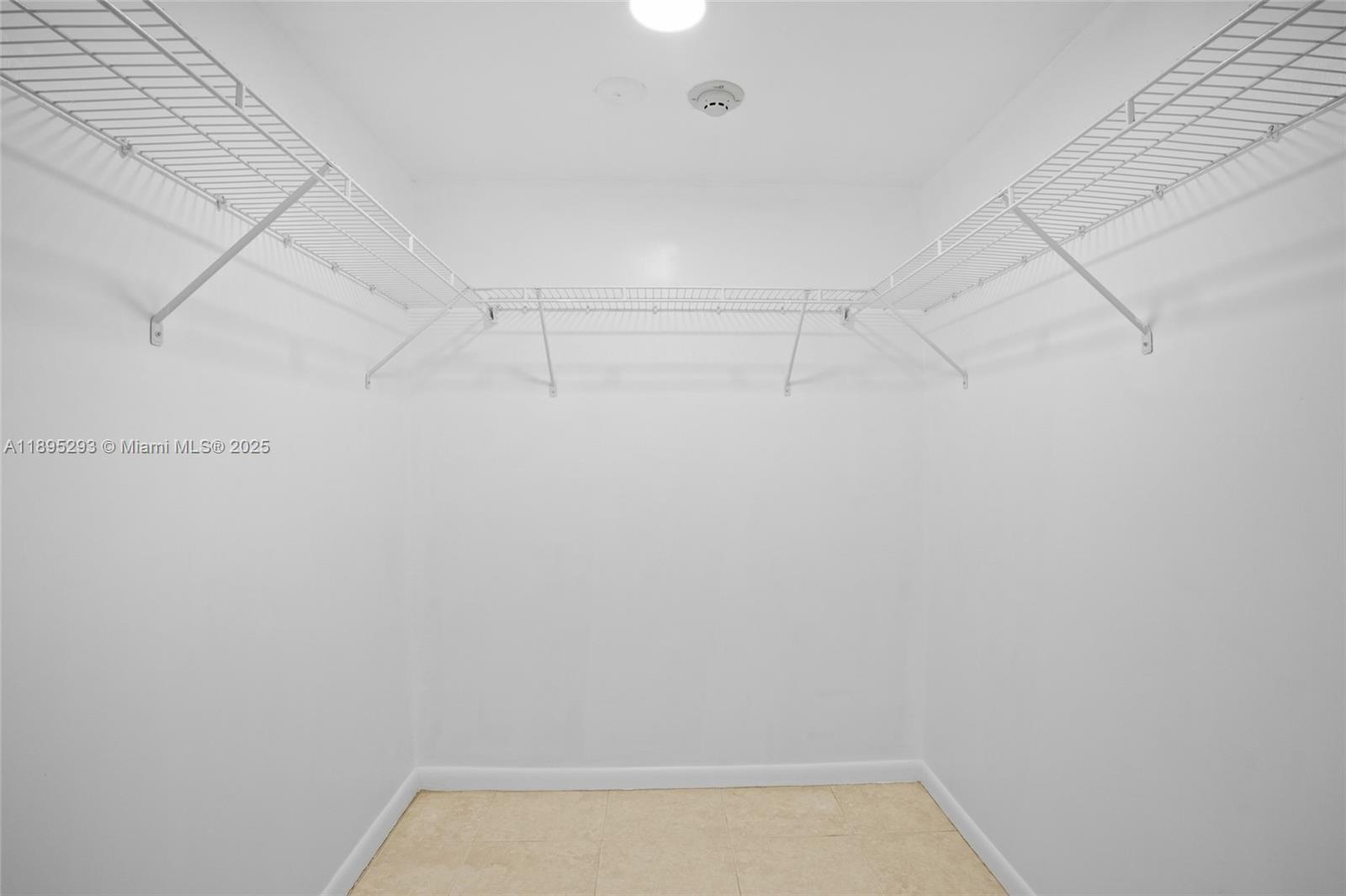 1060 Northwest 7th Street, Unit 106 Miami, FL 33136 - Photo 19 of 26 a view of a room with racks on the wall