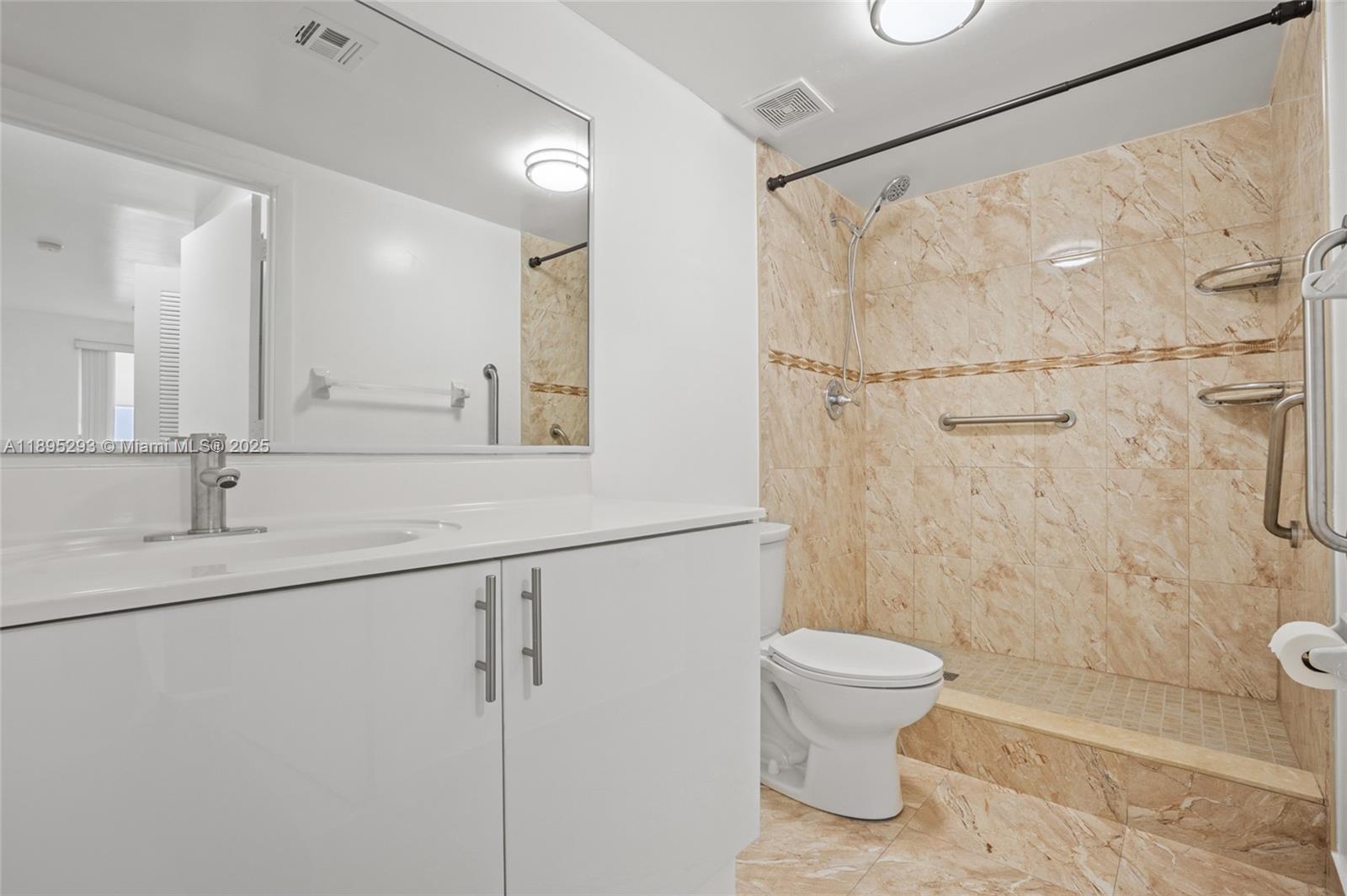 1060 Northwest 7th Street, Unit 106 Miami, FL 33136 - Photo 20 of 26 a bathroom with a toilet sink and shower