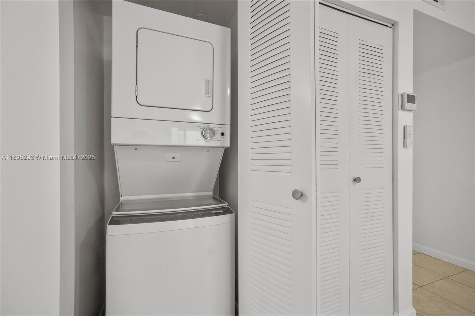 1060 Northwest 7th Street, Unit 106 Miami, FL 33136 - Photo 21 of 26 a utility room with dryer and washer