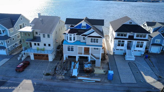 a view of living room with furniture and wooden floor