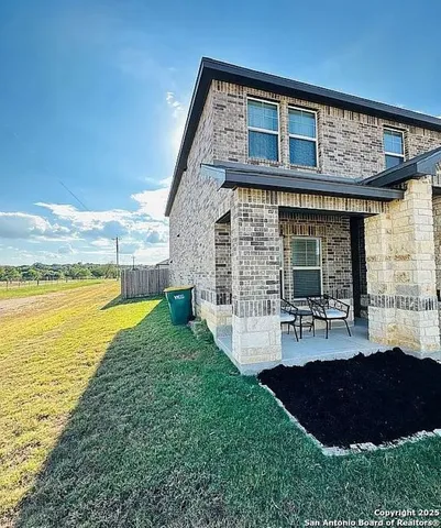 a view of a house with swimming pool and porch