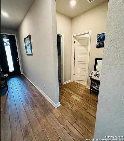 a view of a livingroom with wooden floor