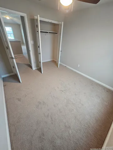 an empty room with a fireplace