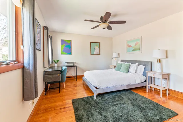 a bedroom with a bed and a table in it