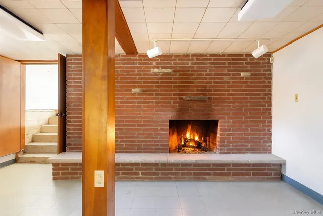 a view of a fireplace with a window