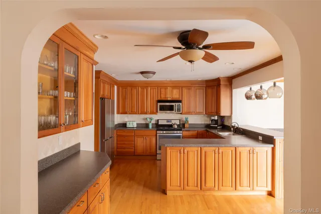 a kitchen with stainless steel appliances granite countertop a stove and a refrigerator