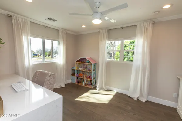 a bedroom with furniture and a window