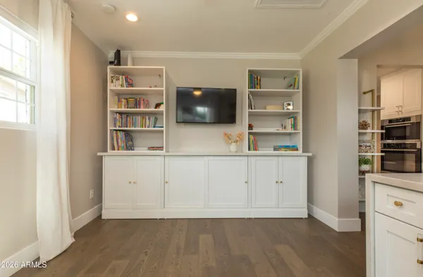 a view of cabinets and wooden floor