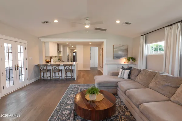 a living room with furniture and a large window
