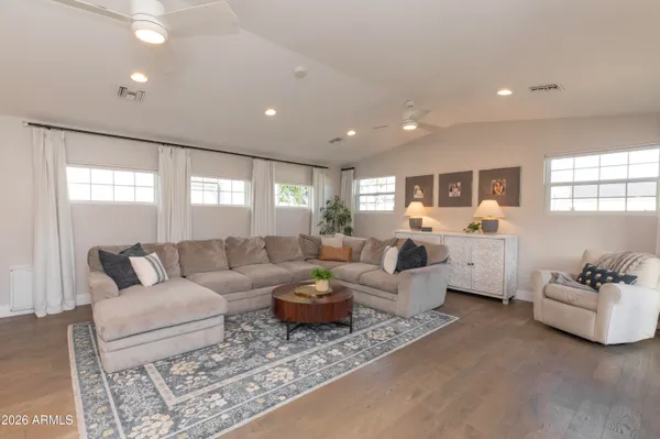 a living room with furniture and a large window