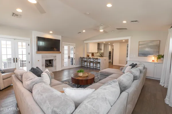 a living room with fireplace furniture and a flat screen tv
