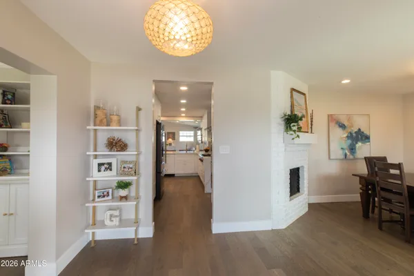 a view of a kitchen with furniture and wooden floor
