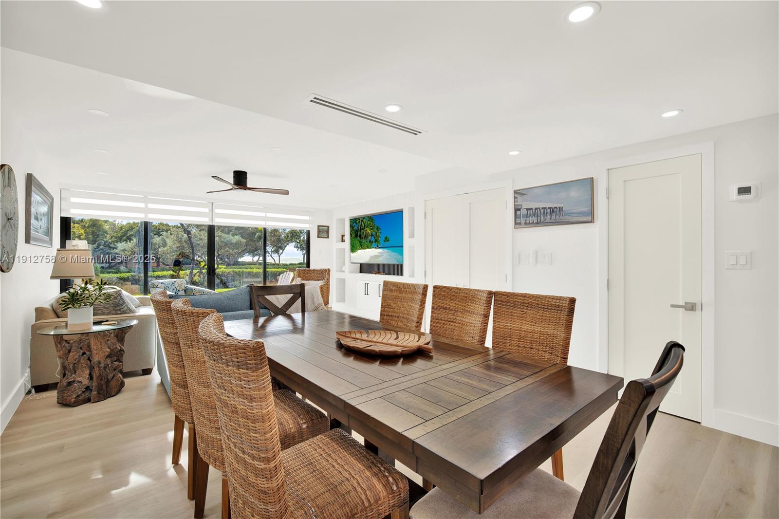 96000 Overseas Highway, Unit L5 Key Largo, FL 33037 - Photo 17 of 55 a view of a dining room with furniture and wooden floor