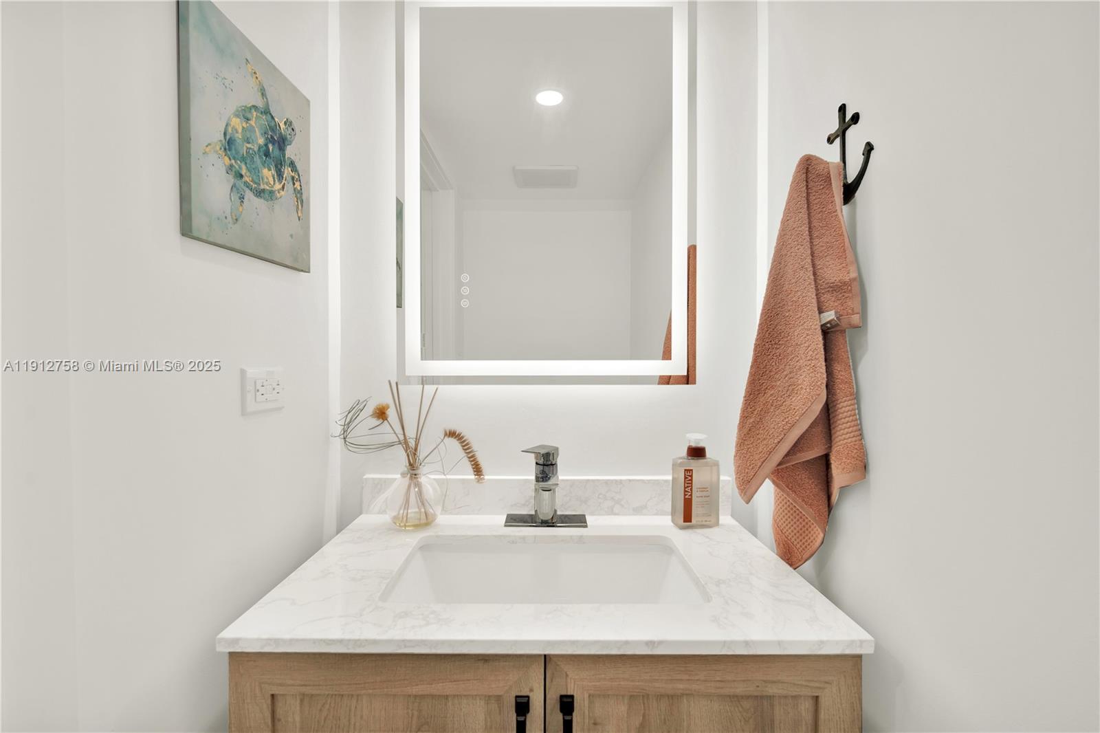 96000 Overseas Highway, Unit L5 Key Largo, FL 33037 - Photo 19 of 55 a bathroom with a sink and a mirror