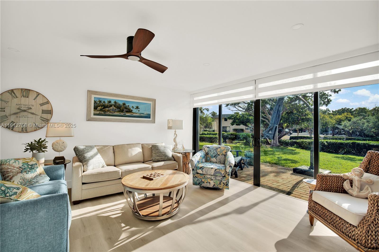 96000 Overseas Highway, Unit L5 Key Largo, FL 33037 - Photo 20 of 55 a living room with furniture and a large window