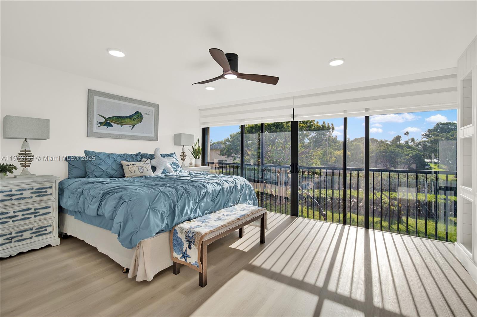 96000 Overseas Highway, Unit L5 Key Largo, FL 33037 - Photo 25 of 55 a bedroom with a large bed and a large window