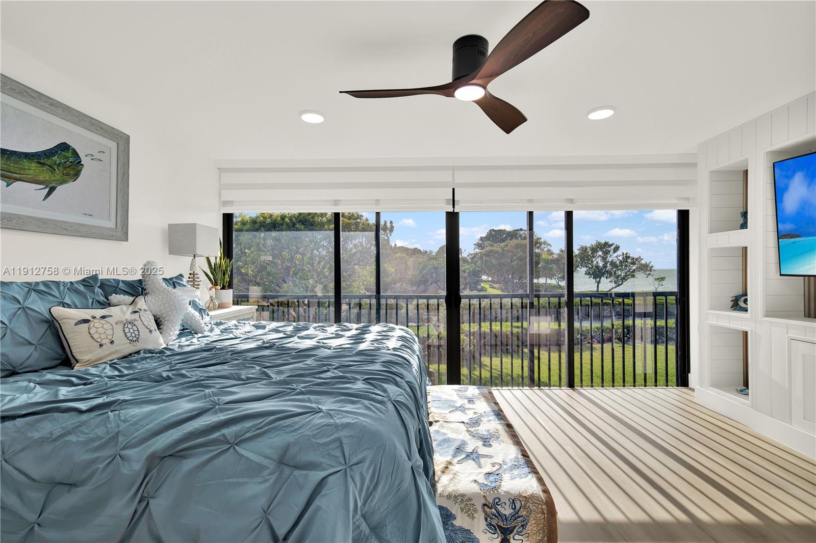 96000 Overseas Highway, Unit L5 Key Largo, FL 33037 - Photo 27 of 55 a bedroom with a large bed and a large window