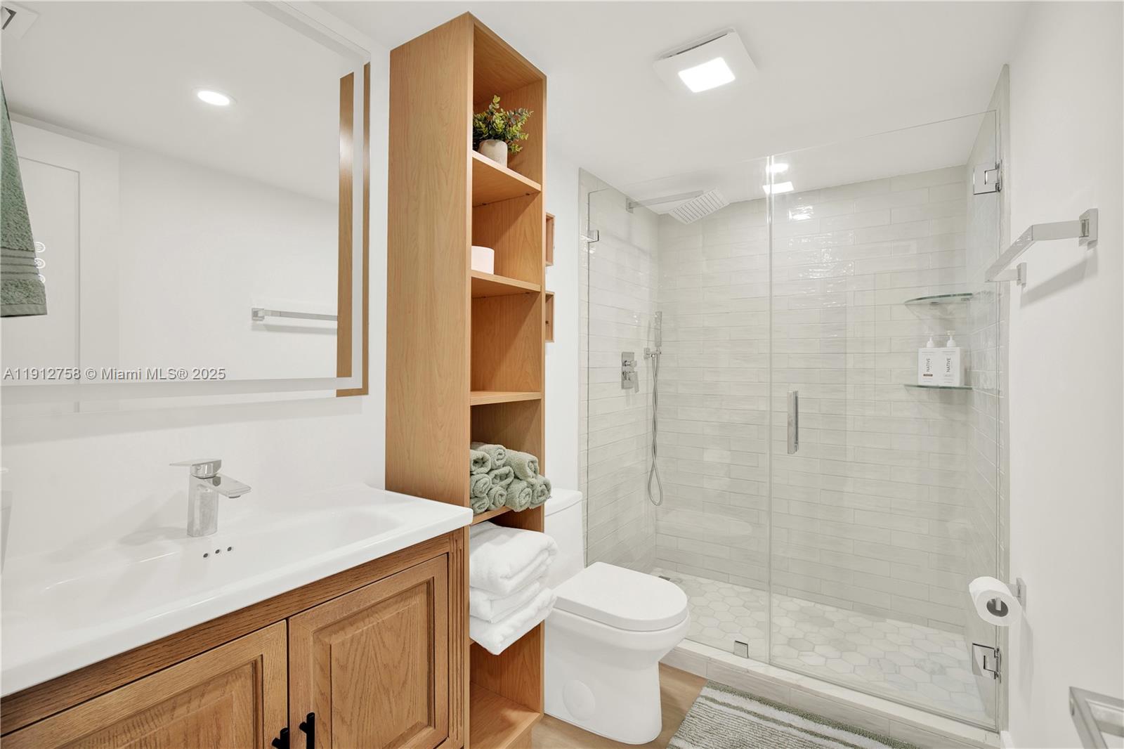 96000 Overseas Highway, Unit L5 Key Largo, FL 33037 - Photo 29 of 55 a bathroom with a sink a toilet and shower