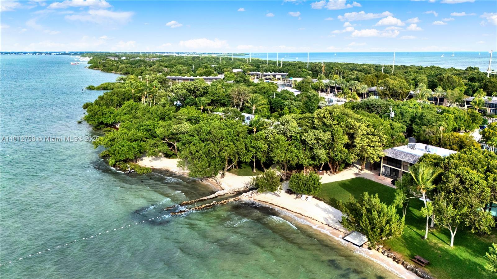 96000 Overseas Highway, Unit L5 Key Largo, FL 33037 - Photo 3 of 55 an aerial view of a houses with a yard