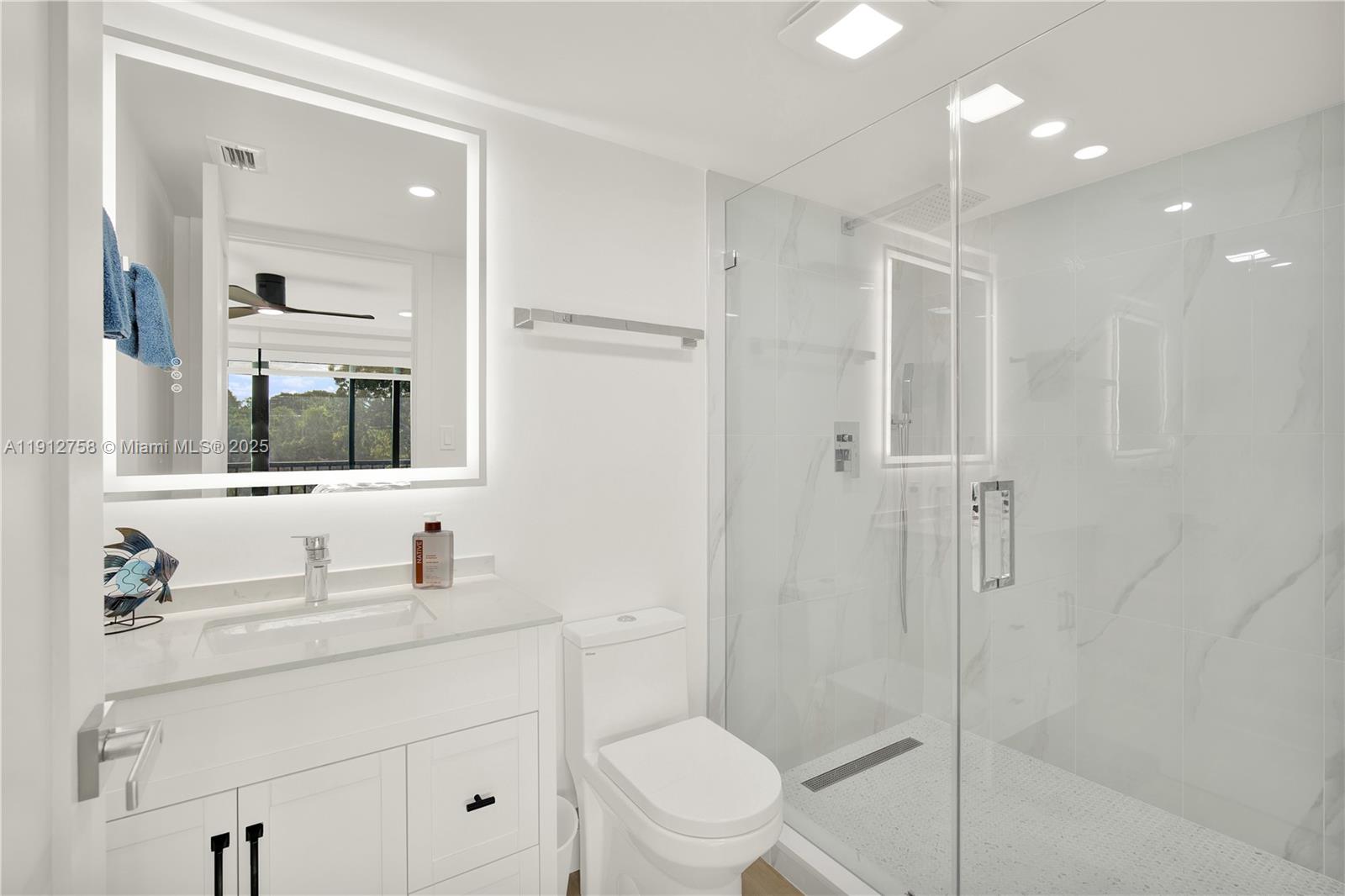 96000 Overseas Highway, Unit L5 Key Largo, FL 33037 - Photo 32 of 55 a bathroom with a sink a toilet and shower