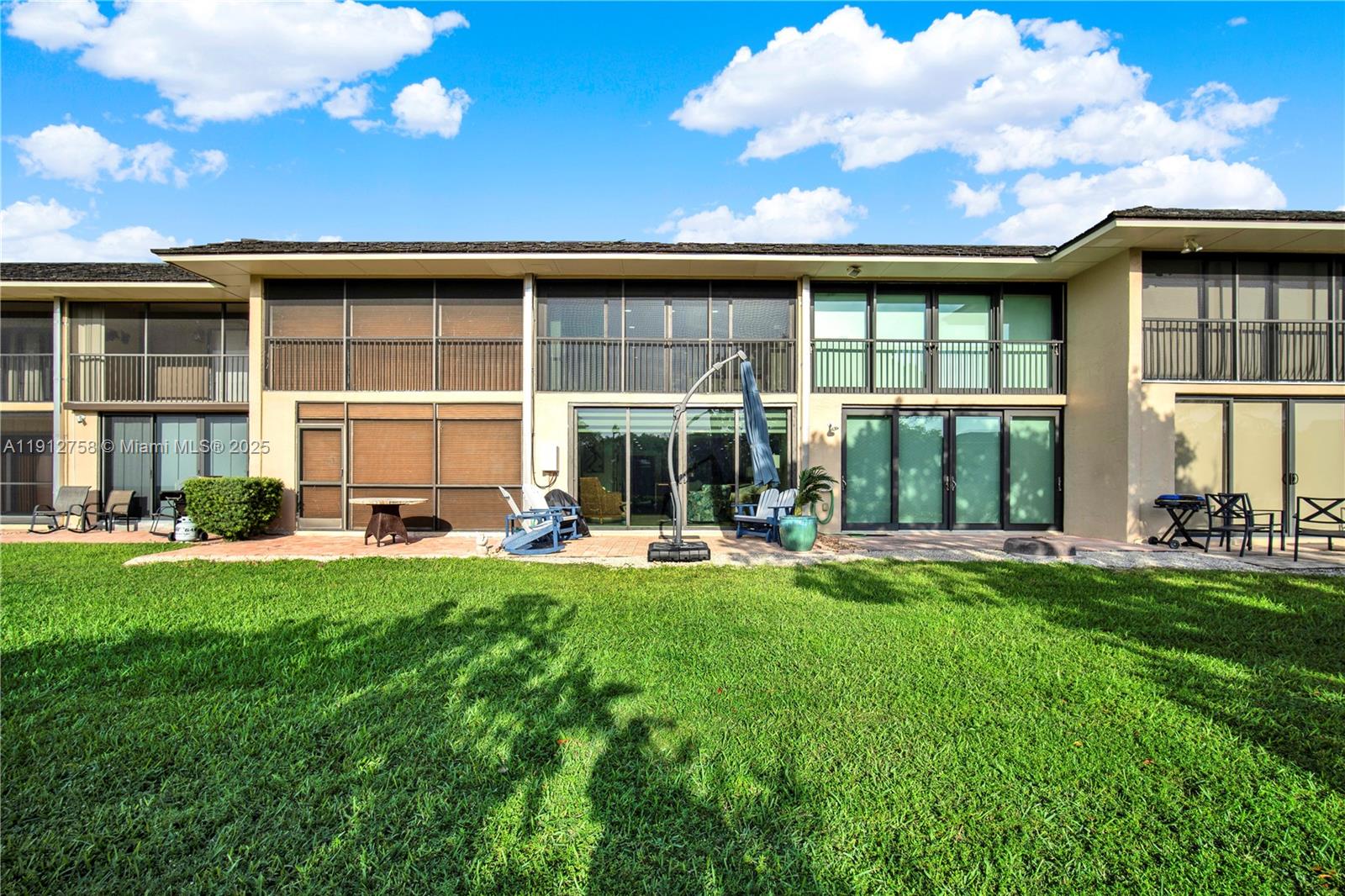 96000 Overseas Highway, Unit L5 Key Largo, FL 33037 - Photo 35 of 55 a view of a house with backyard sitting area and garden