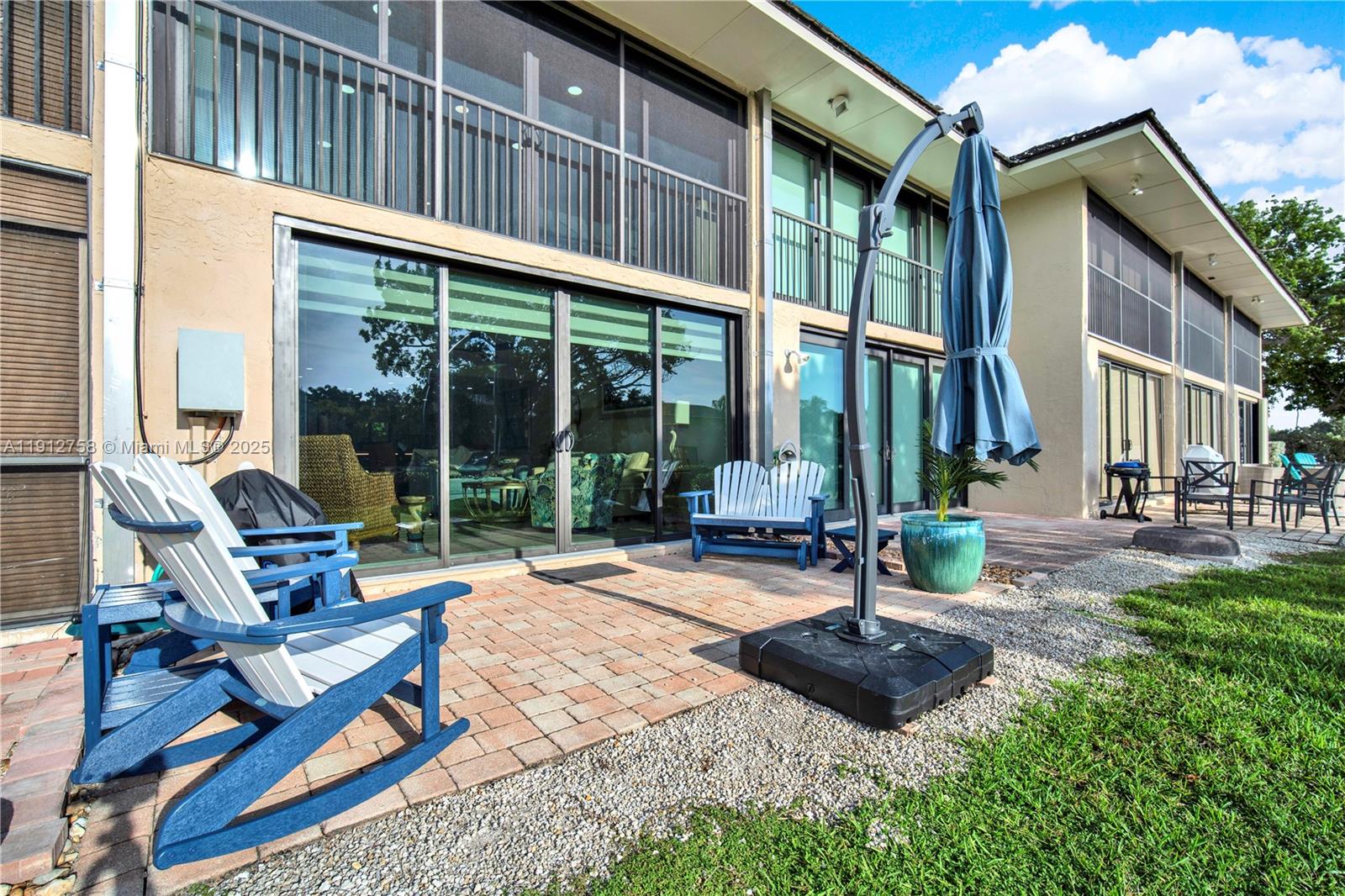 96000 Overseas Highway, Unit L5 Key Largo, FL 33037 - Photo 36 of 55 a view of a patio with a table and chairs