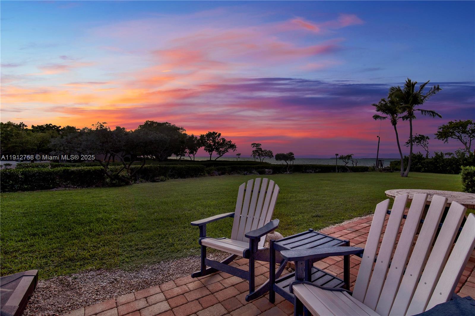 96000 Overseas Highway, Unit L5 Key Largo, FL 33037 - Photo 38 of 55 a view of a lake with a yard