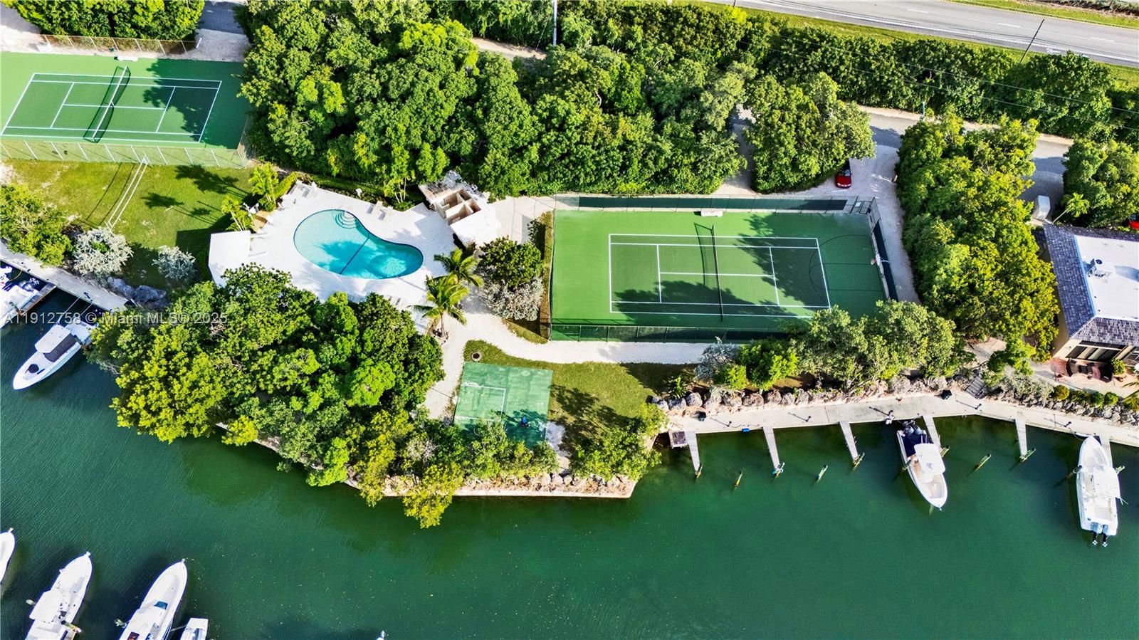 96000 Overseas Highway, Unit L5 Key Largo, FL 33037 - Photo 45 of 55 a front view of a house with garden