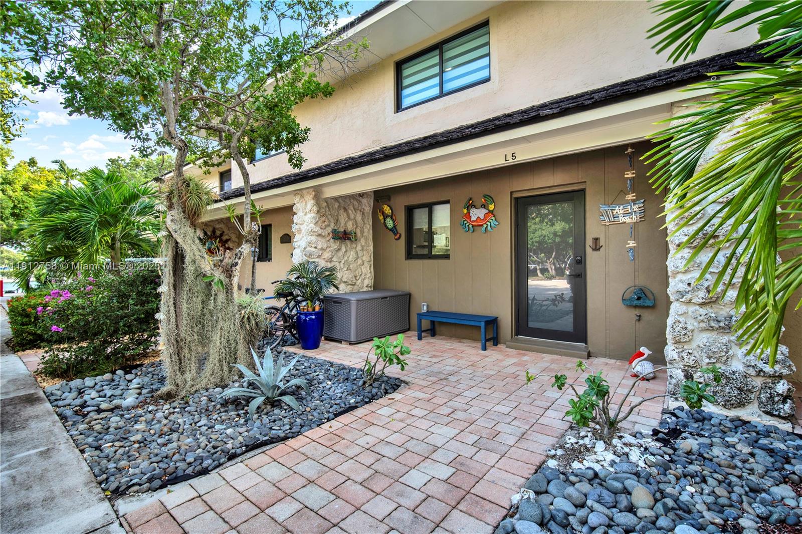 96000 Overseas Highway, Unit L5 Key Largo, FL 33037 - Photo 5 of 55 a view of a house with potted plants