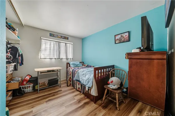 a bedroom with furniture and a fireplace