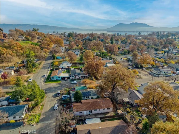 an aerial view of residential houses with outdoor space