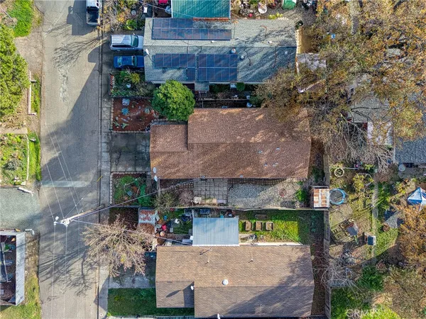 an aerial view of a house with a garden and plants