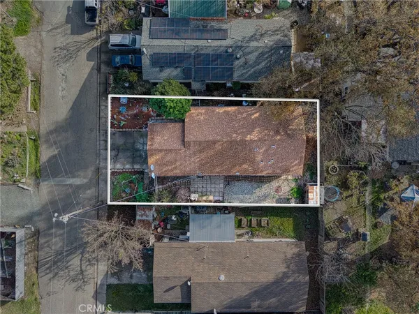 an aerial view of house with yard