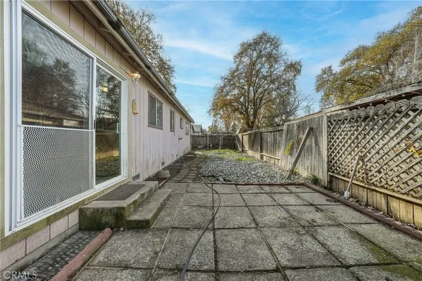 a view of a back yard of the house