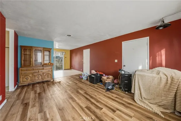 a room with wooden floor and furniture