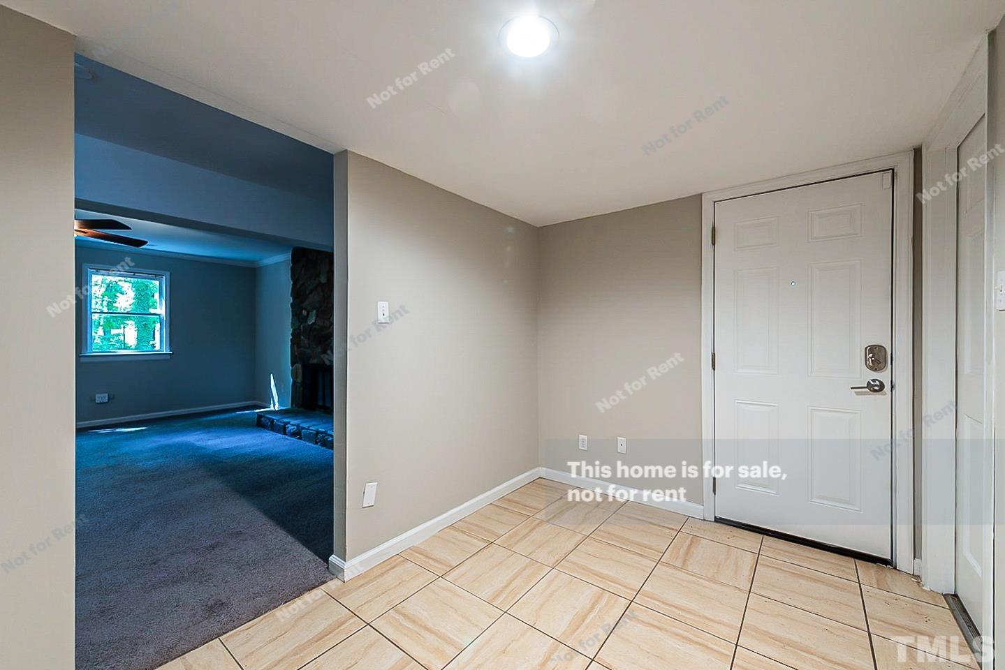 916 East Millbrook Road Raleigh, NC 27609 - Photo 15 of 24 a view of a hallway with wooden floor and cabinet
