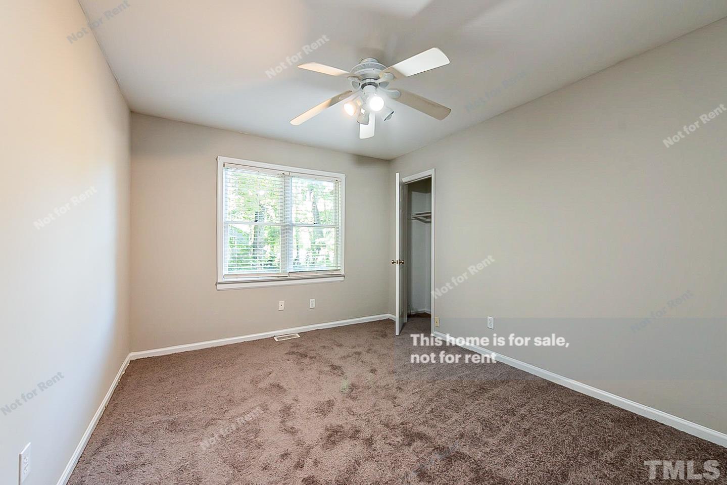 916 East Millbrook Road Raleigh, NC 27609 - Photo 17 of 24 a view of an empty room with a window
