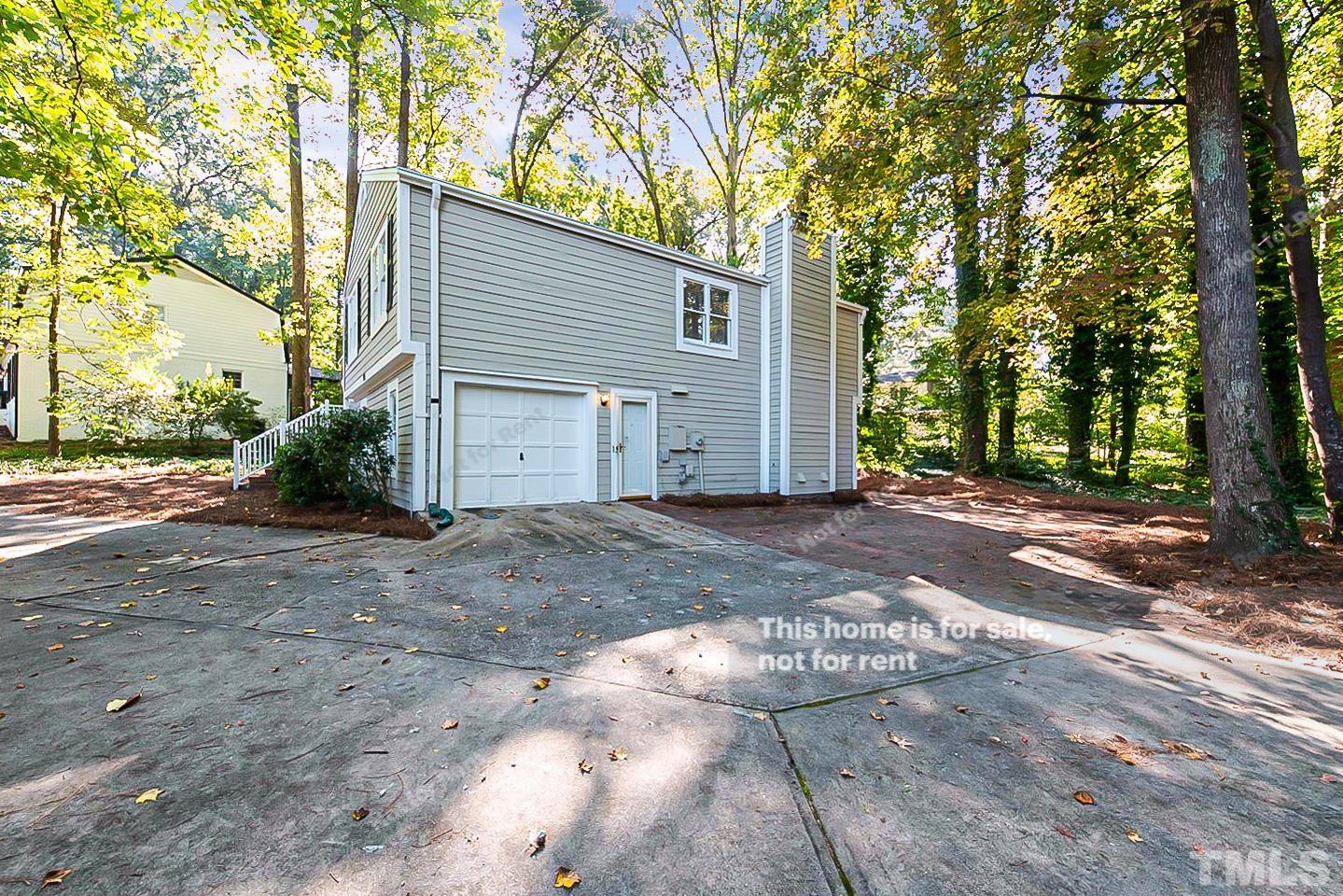 916 East Millbrook Road Raleigh, NC 27609 - Photo 21 of 24 a view of a house with a yard
