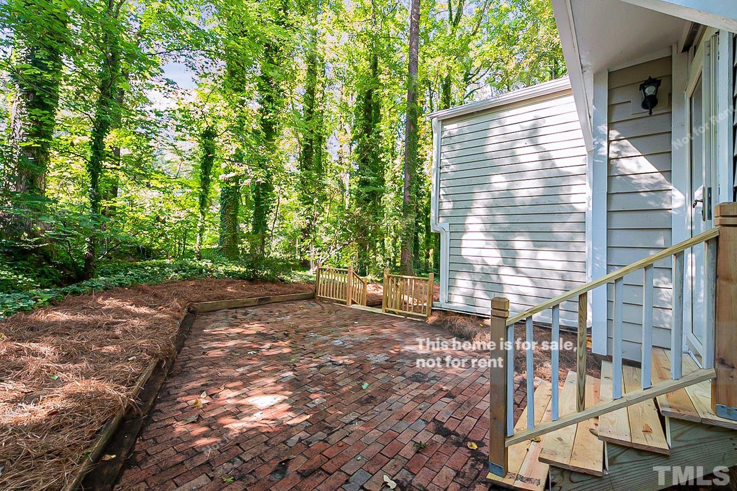 916 East Millbrook Road Raleigh, NC 27609 - Photo 23 of 24 a view of a house with a yard