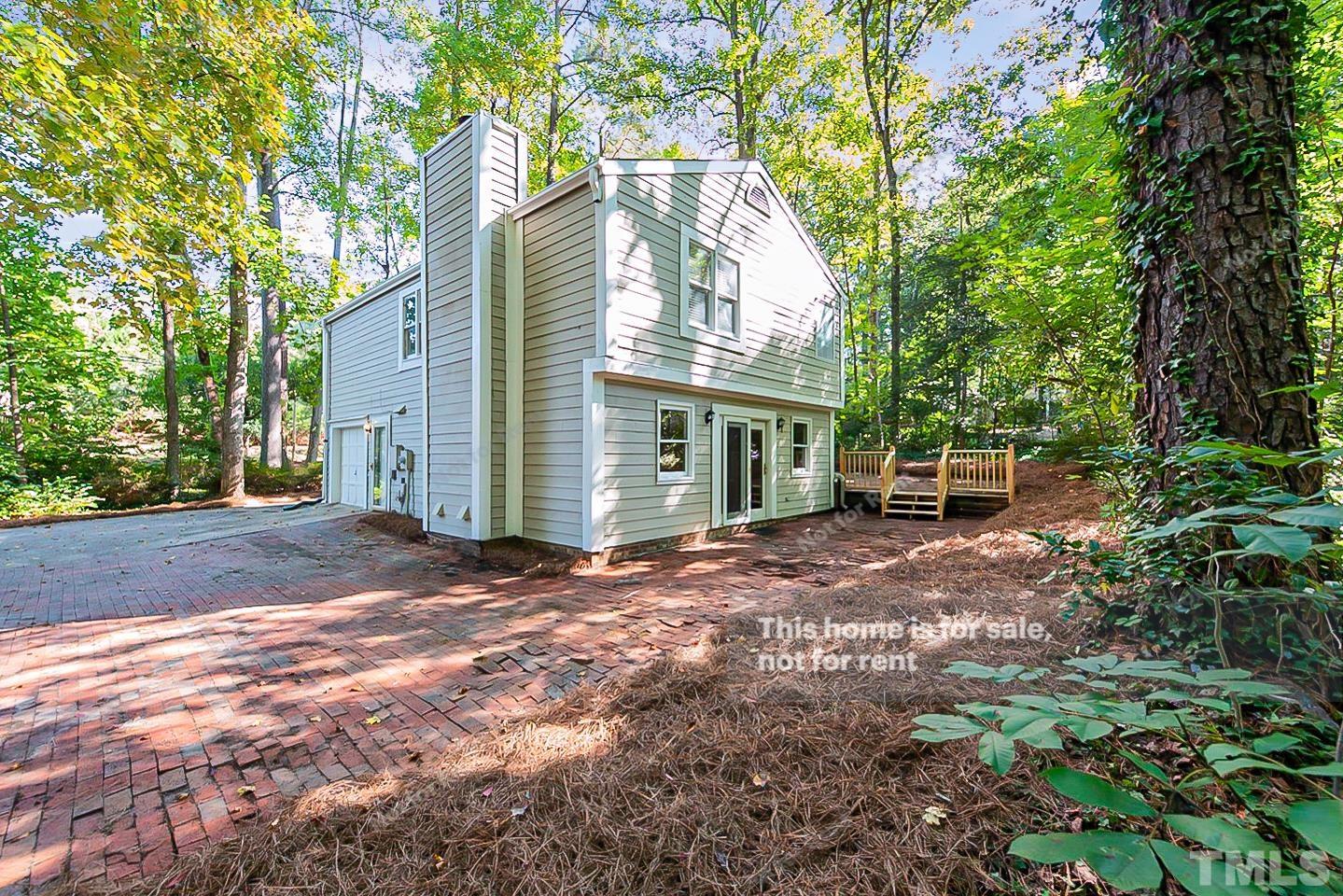 916 East Millbrook Road Raleigh, NC 27609 - Photo 24 of 24 a view of a house with backyard and a tree