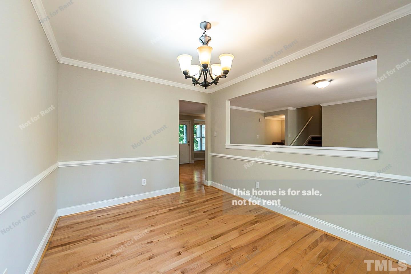 916 East Millbrook Road Raleigh, NC 27609 - Photo 7 of 24 a view of a chandelier in a room