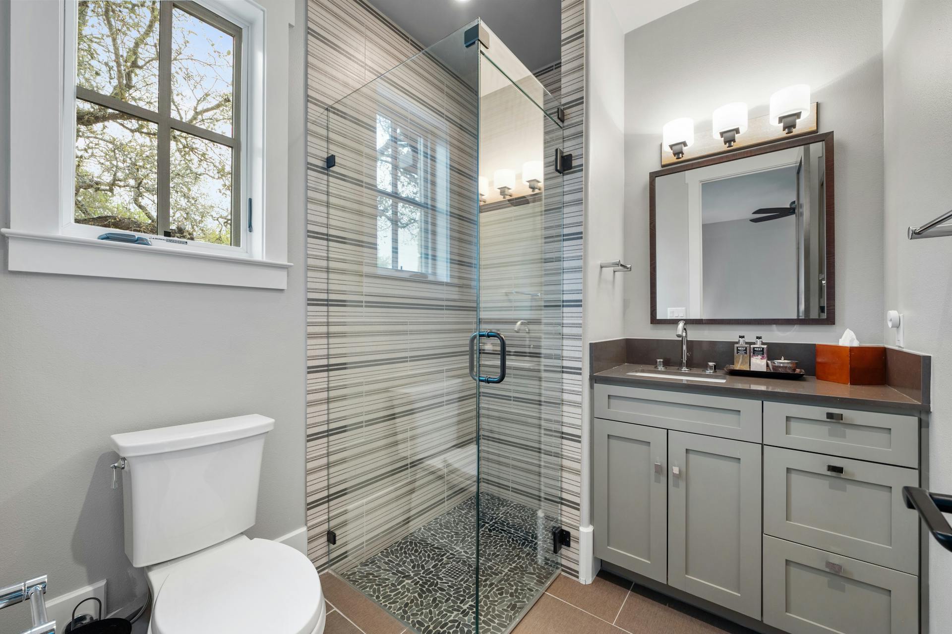 1330 Ranchers Club Lane Driftwood, TX 78619 - Photo 27 of 40 Full bathroom featuring vanity, a stall shower, and light tile patterned flooring